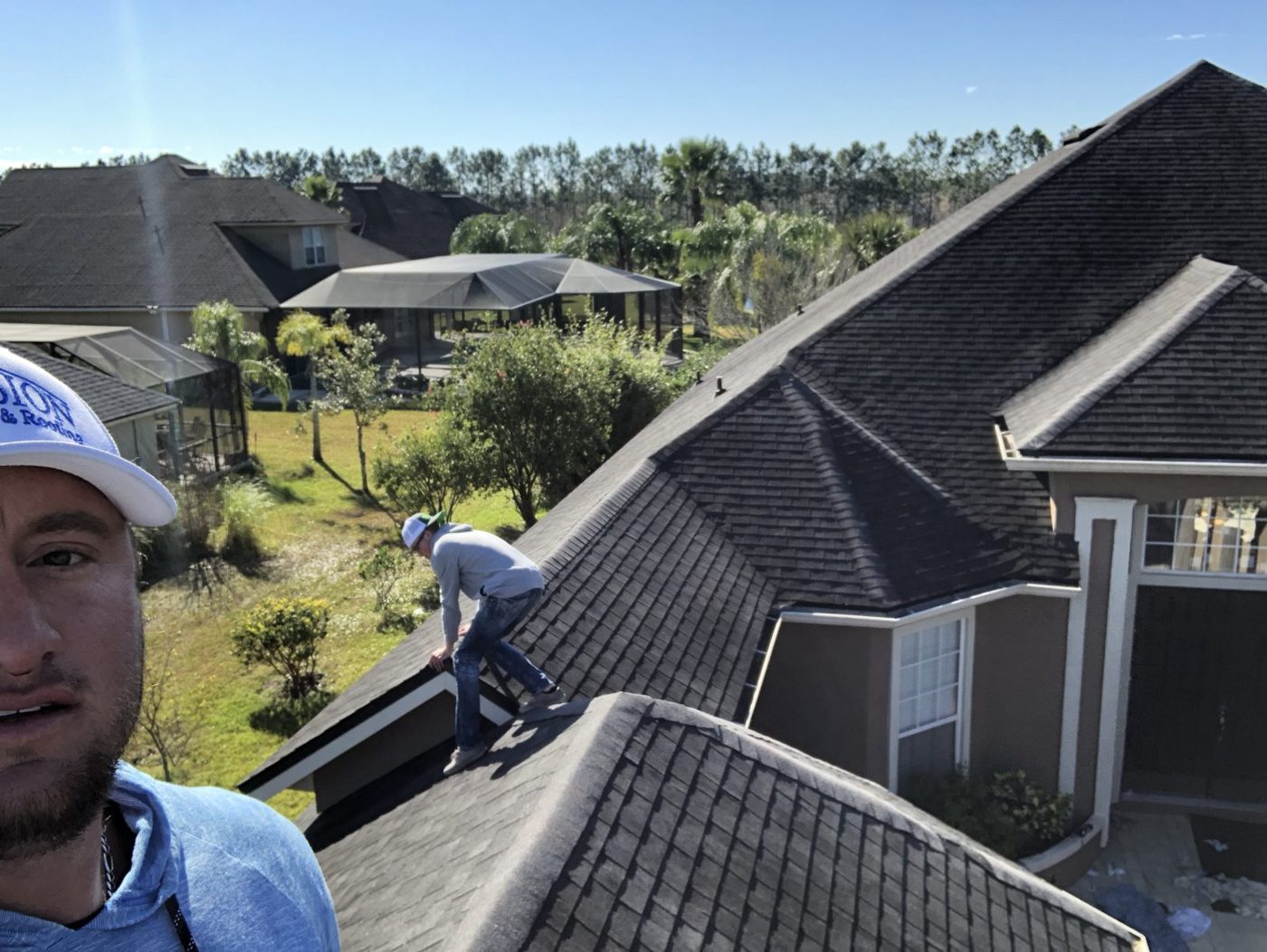 Our team walking every slope of a shingle roof after a storm.